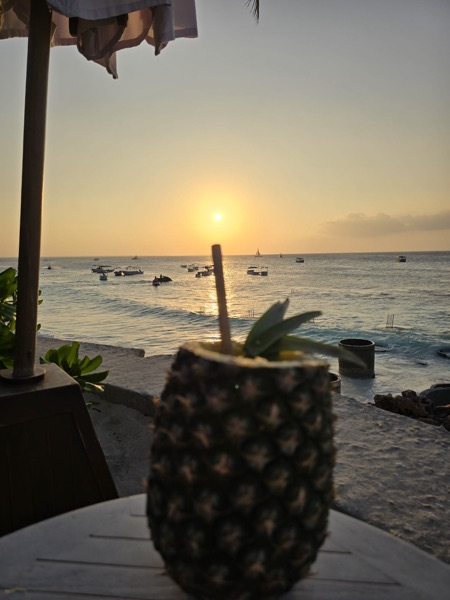 Pineapple cocktail at golden sunset
